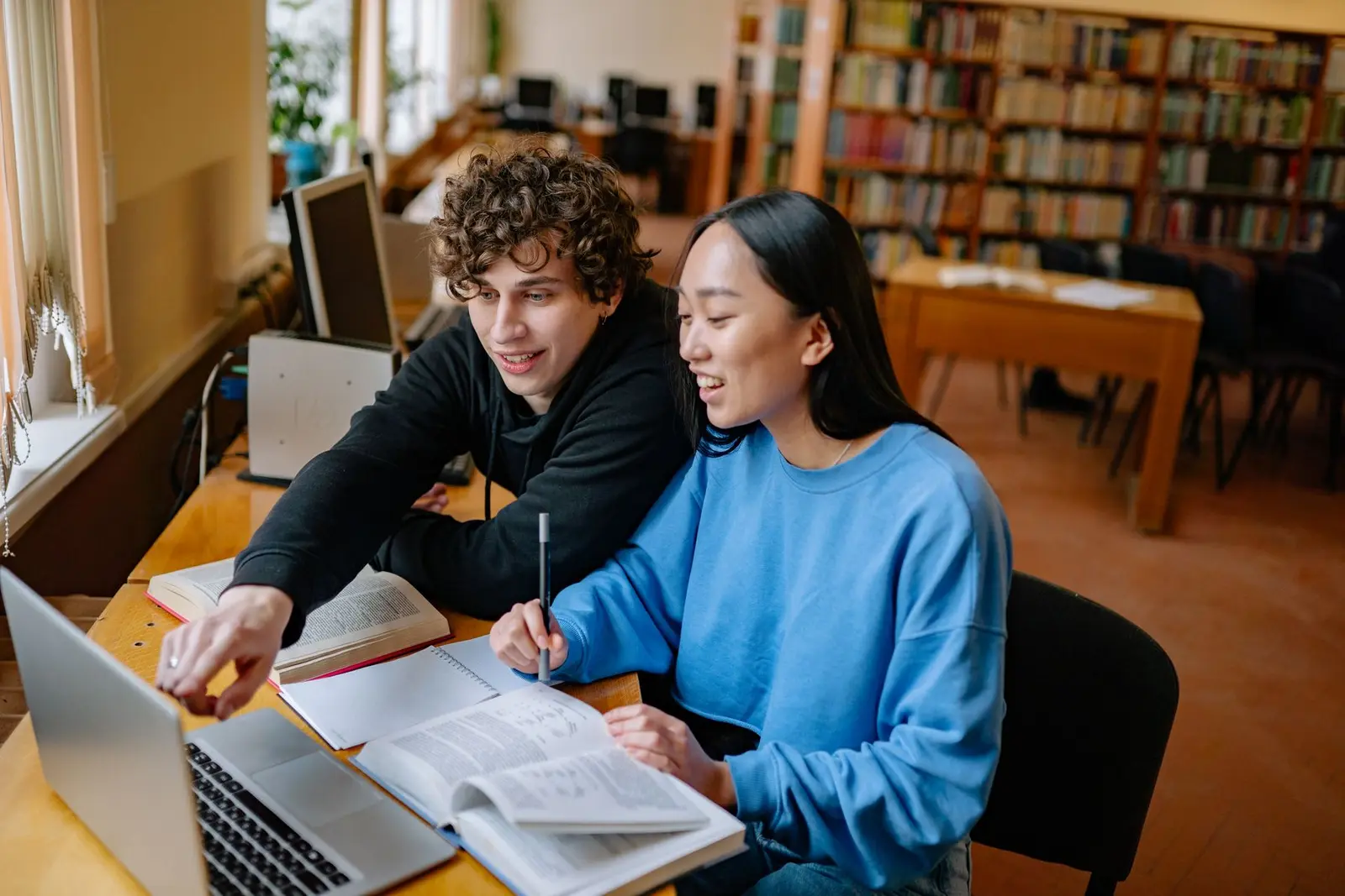 University students studying together in a library
